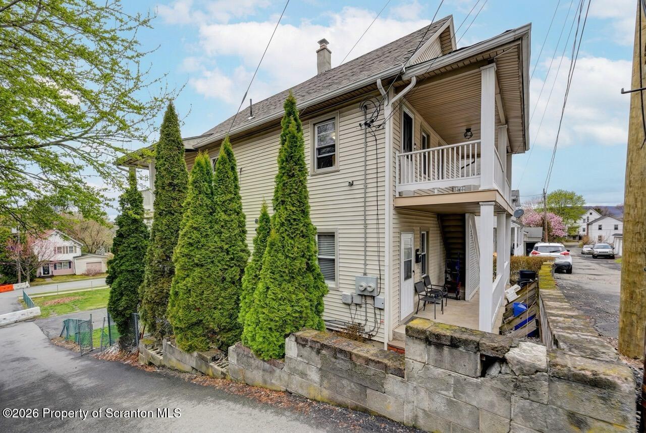 641 East Elm Street Scranton, PA 18505 - Photo 5 of 59 a front view of a house with garden