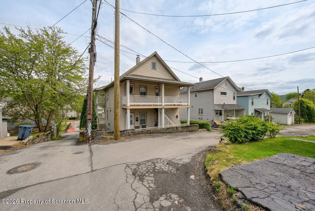 641 East Elm Street Scranton, PA 18505 - Photo 59 of 59 a view of a big house with a yard and plants