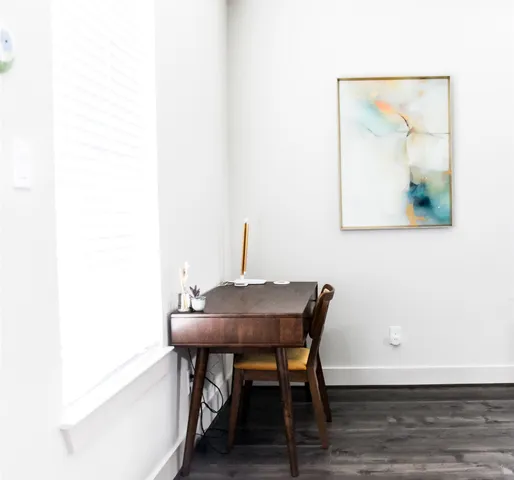 a view of a workspace with furniture