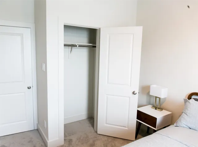 a bedroom with a bed and a table