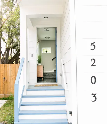 a view of staircase with white walls