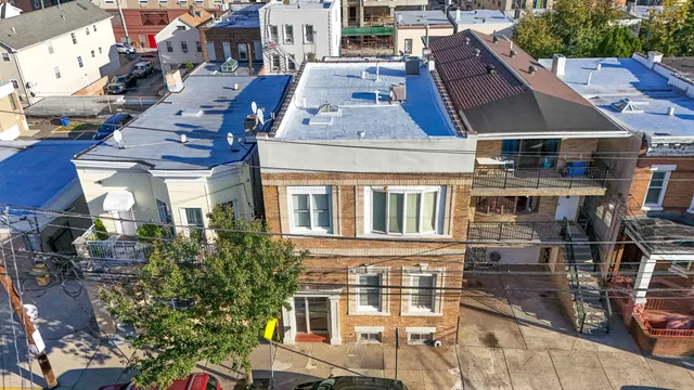 a front view of a building with many windows