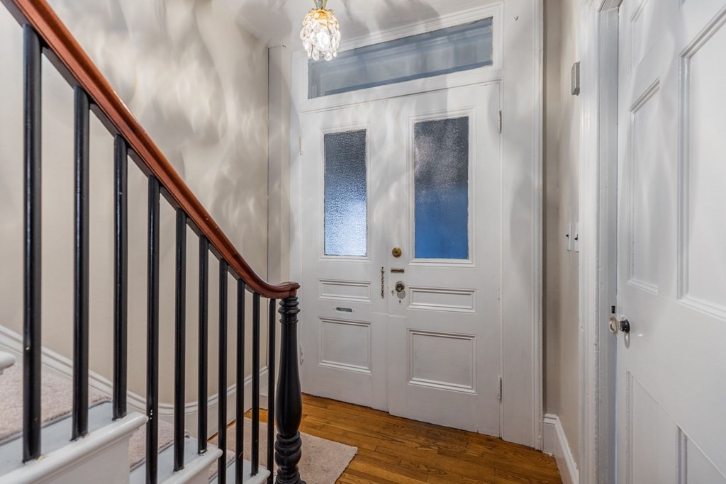 32 High Street Boston, MA 02129 - Photo 12 of 38 a view of a hallway with wooden floor and staircase