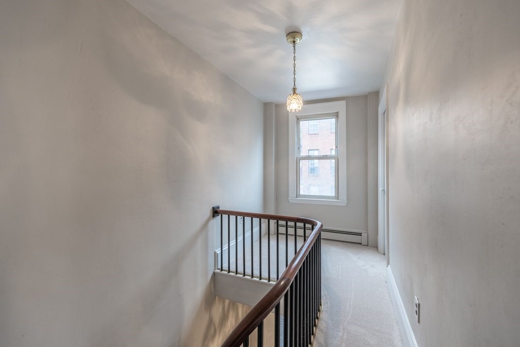32 High Street Boston, MA 02129 - Photo 13 of 38 a view of a hallway with windows