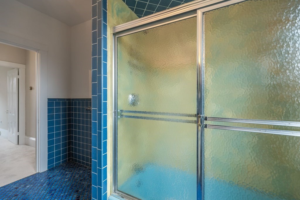32 High Street Boston, MA 02129 - Photo 27 of 38 a bathroom with a glass shower door