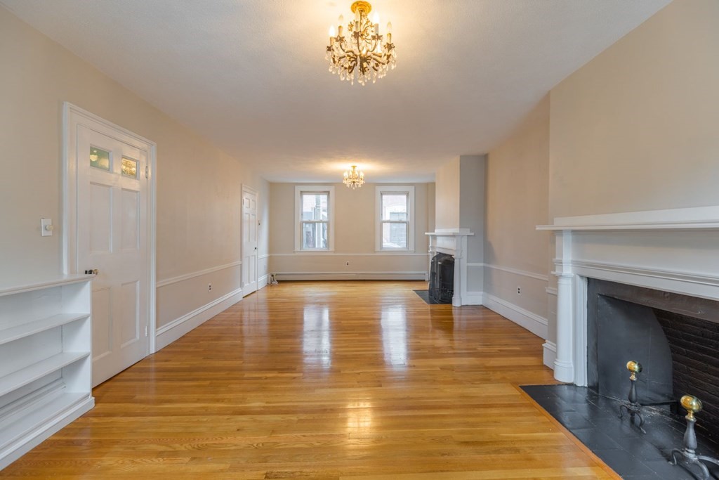 32 High Street Boston, MA 02129 - Photo 6 of 38 a view of empty room with wooden floor and fan