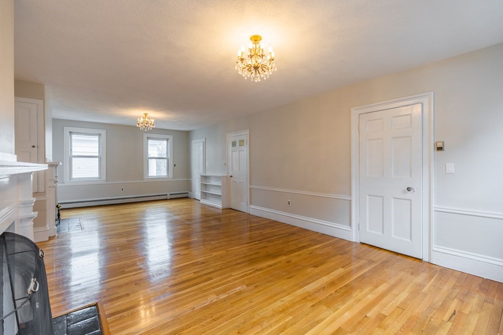 32 High Street Boston, MA 02129 - Photo 8 of 38 a view of empty room with wooden floor and fan