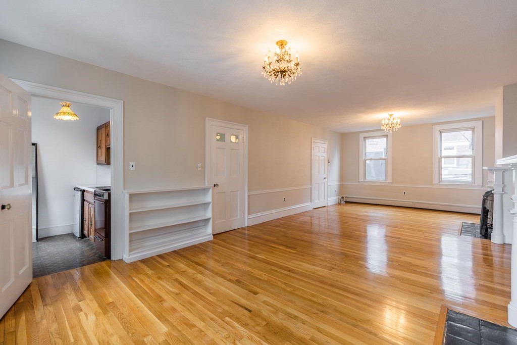 32 High Street Boston, MA 02129 - Photo 10 of 38 a view of empty room with wooden floor and fan