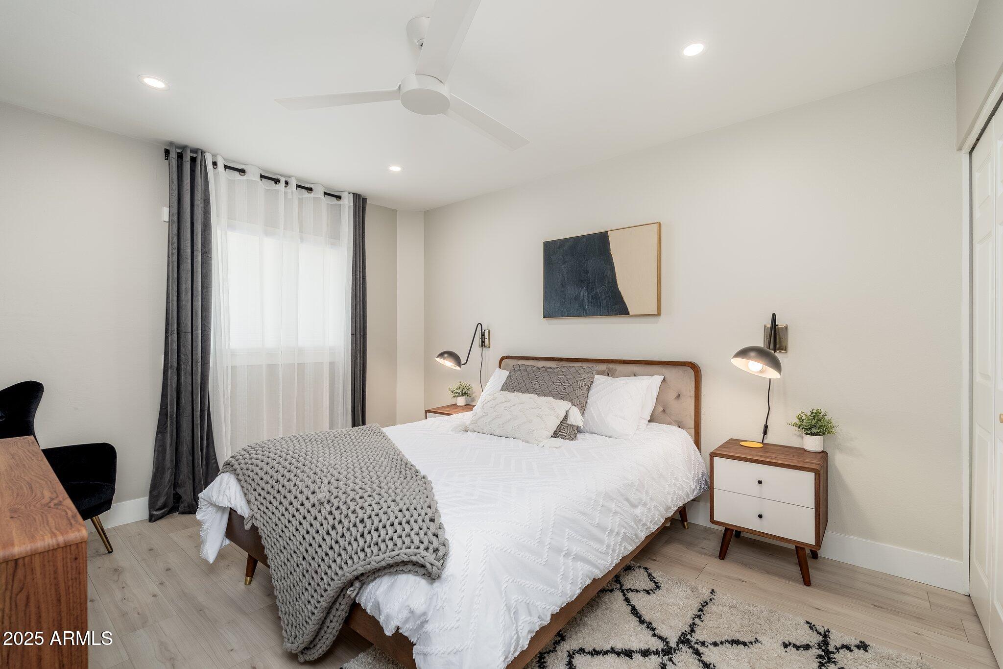 6957 East Osborn Road, Unit A Scottsdale, AZ 85251 - Photo 20 of 29 a bedroom with a bed and a window