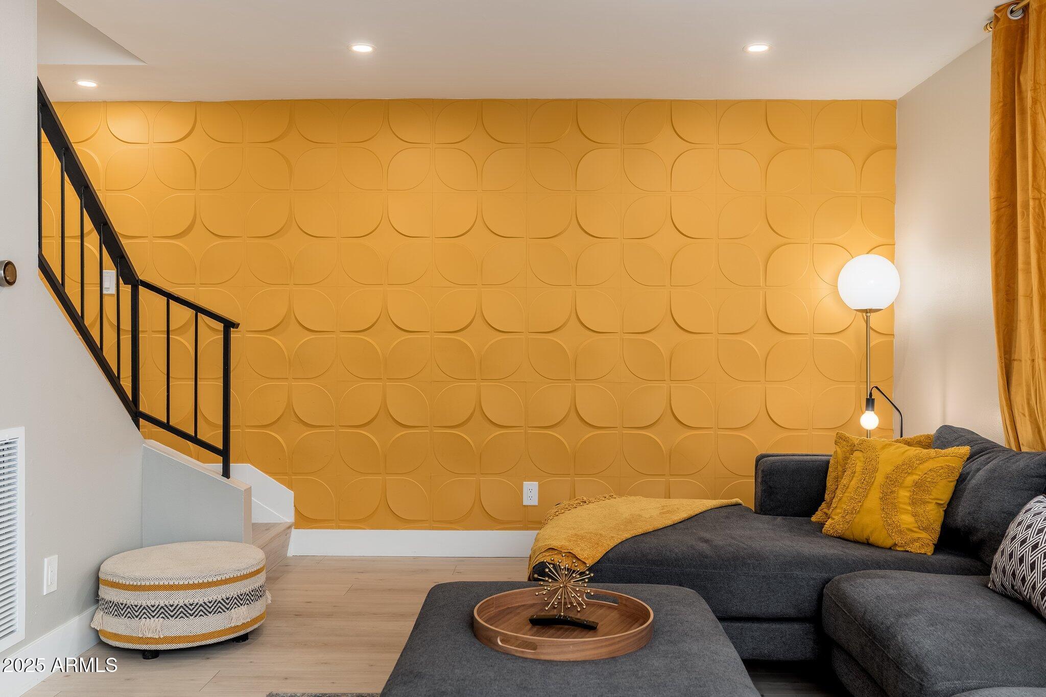 6957 East Osborn Road, Unit A Scottsdale, AZ 85251 - Photo 5 of 29 a living room with furniture and a lamp