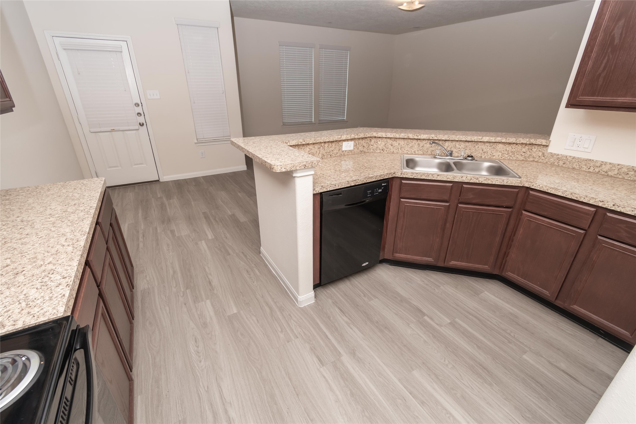 a kitchen with a sink and cabinets