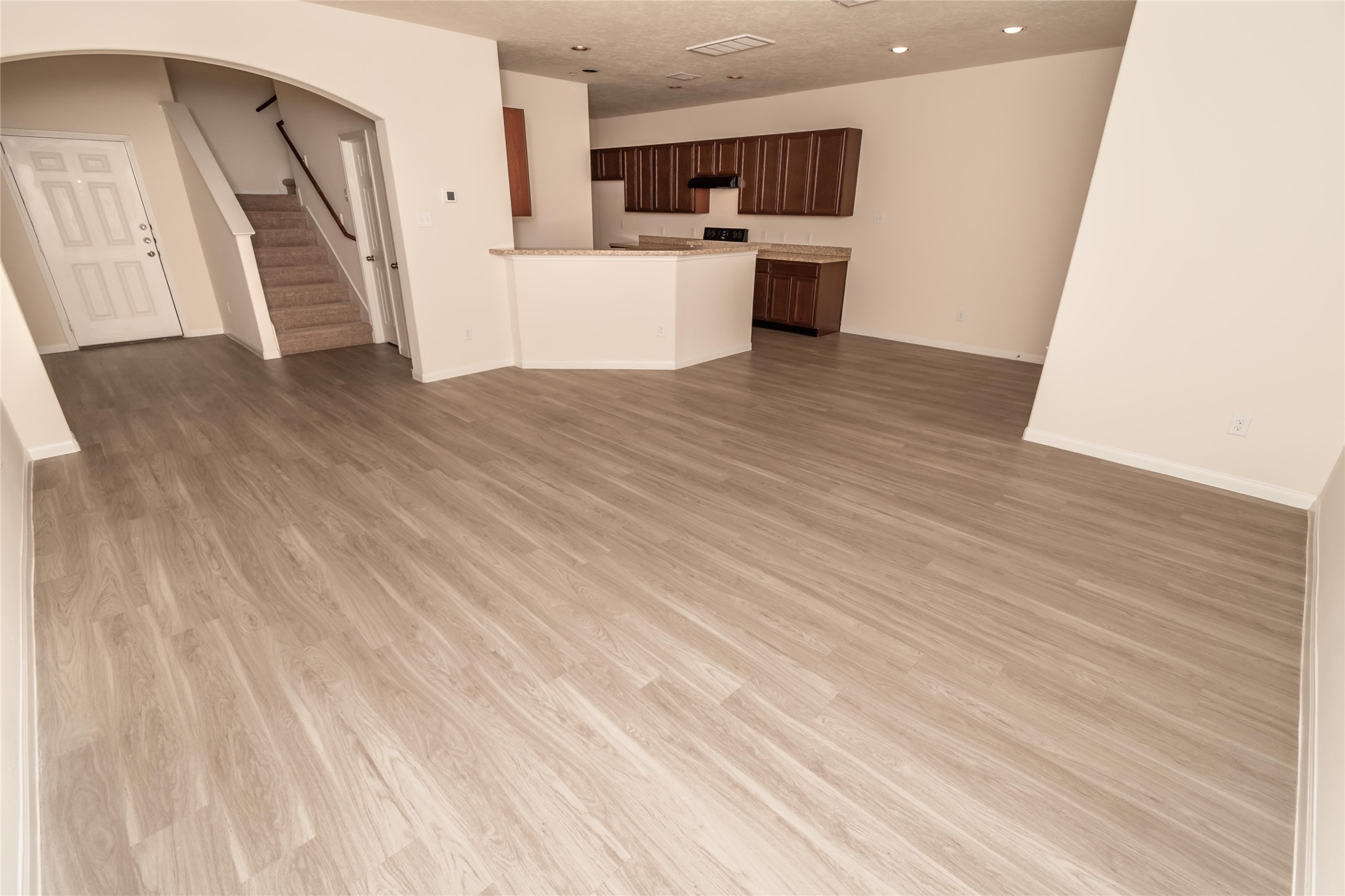 3918 Calgary Circle Missouri City, TX 77459 - Photo 3 of 9 a view of a kitchen with wooden floor and electronic appliances