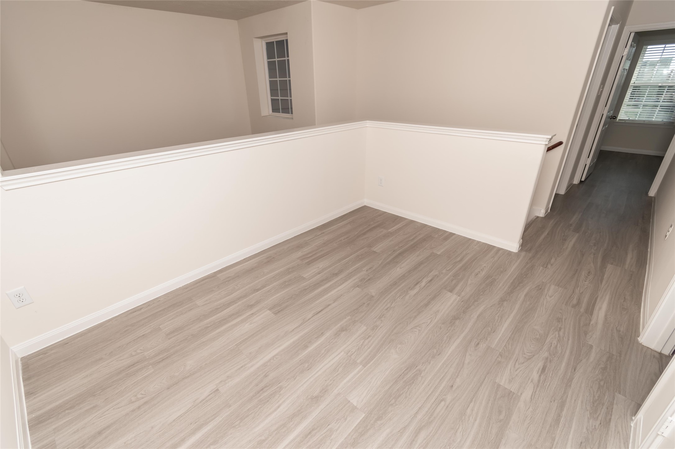 3918 Calgary Circle Missouri City, TX 77459 - Photo 7 of 9 a view of a big room with wooden floor