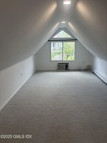 an empty room with windows and entrance