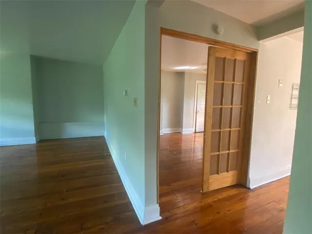 a view of gallery with wooden floor