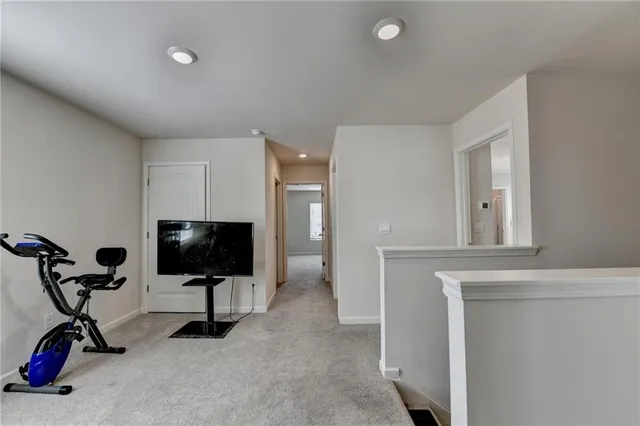 a view of a livingroom with storage and utility room