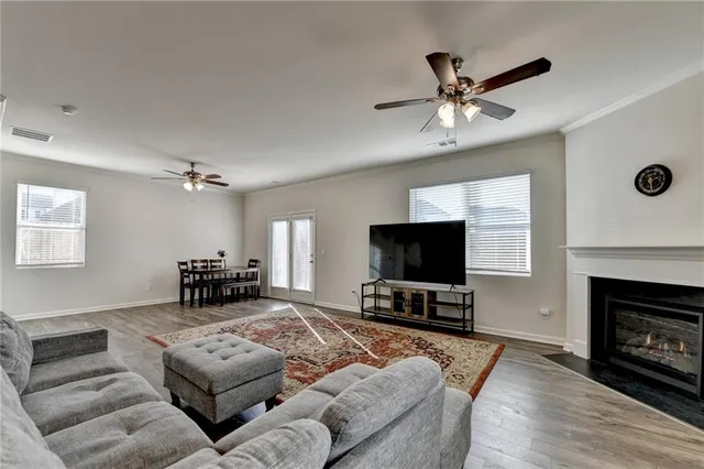 a bedroom with a bed and ceiling fan
