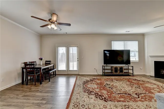 a view of a livingroom with furniture and a flat screen tv