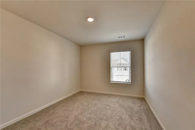 an empty room with window and window