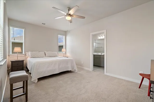 a bedroom with a bed and a chair