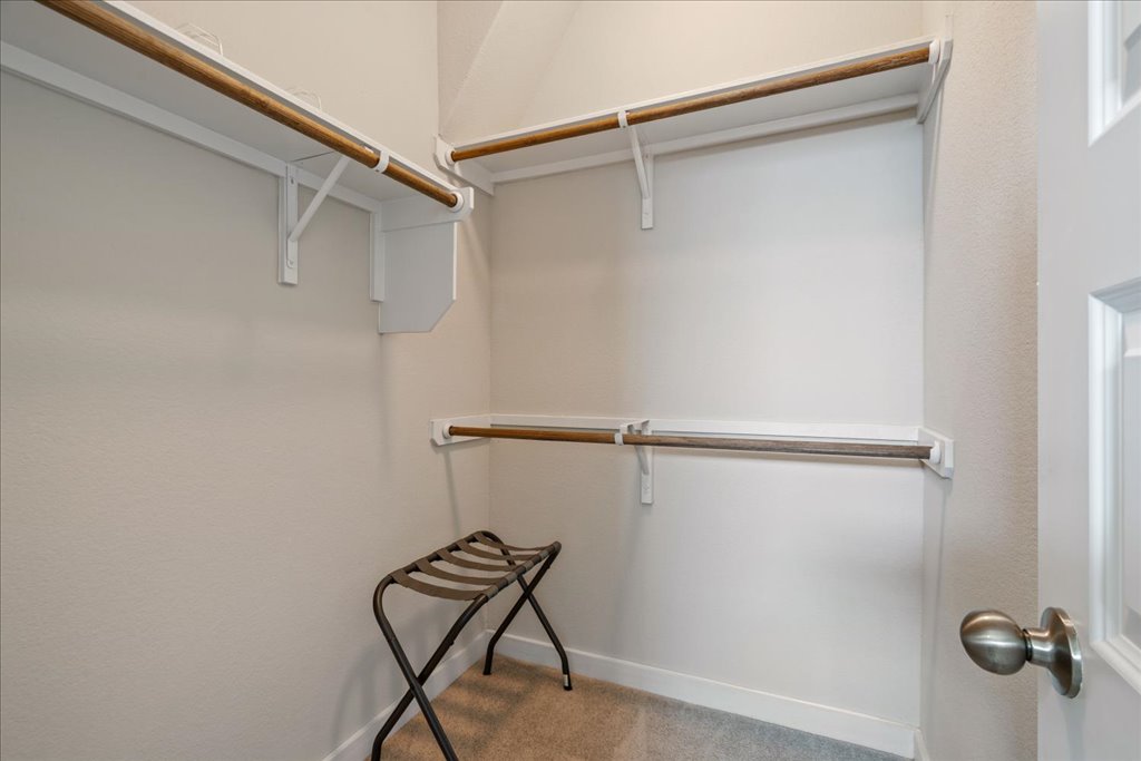 330 Hortus Drive Kyle, TX 78640 - Photo 18 of 26 a view of a room with racks on the wall