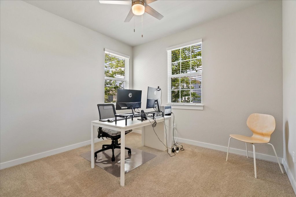 330 Hortus Drive Kyle, TX 78640 - Photo 20 of 26 a view of a workspace with furniture and a window