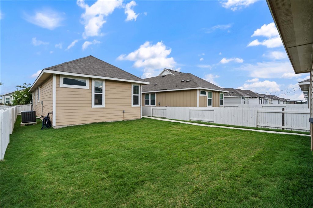 330 Hortus Drive Kyle, TX 78640 - Photo 26 of 26 a backyard of a house with lots of green space