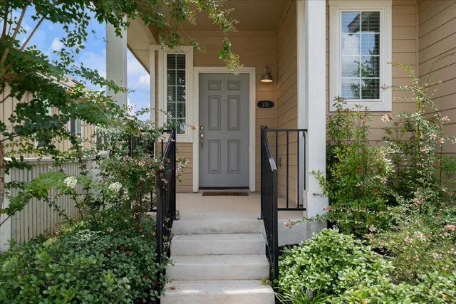 a view of a pathway of house with yard