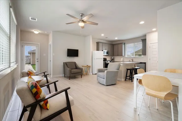 a living room with fireplace furniture and a flat screen tv