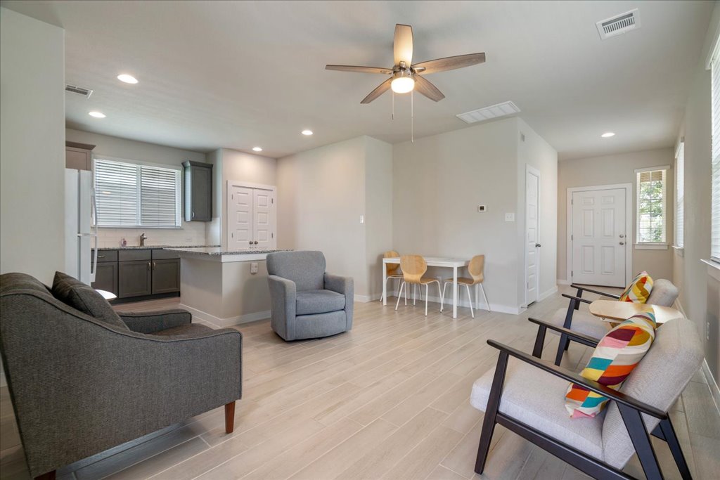 330 Hortus Drive Kyle, TX 78640 - Photo 6 of 26 a living room with furniture and a chandelier