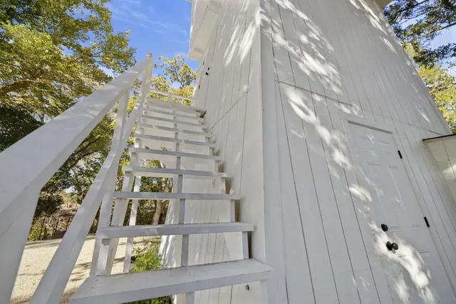 a stove top oven sitting inside of a kitchen
