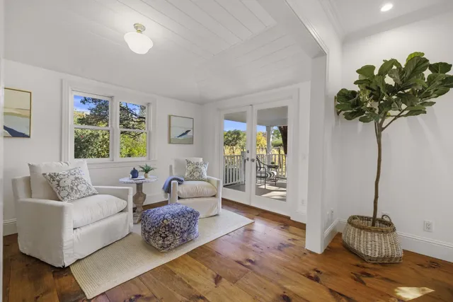 a view of an entryway with wooden floor