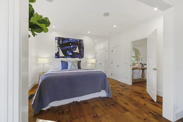a view of a patio with a table and chairs under an umbrella