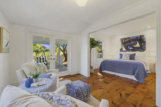 a view of a yard with wooden fence