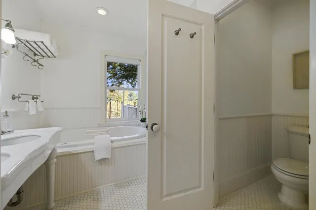 a view of a wooden door with a small yard