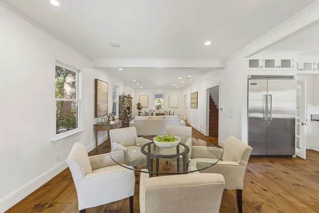 a bedroom with a bed and a potted plant