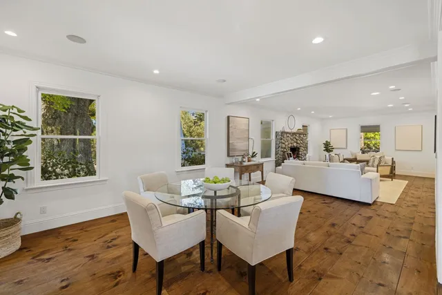 a en suite bathroom with a granite countertop sink and a mirror