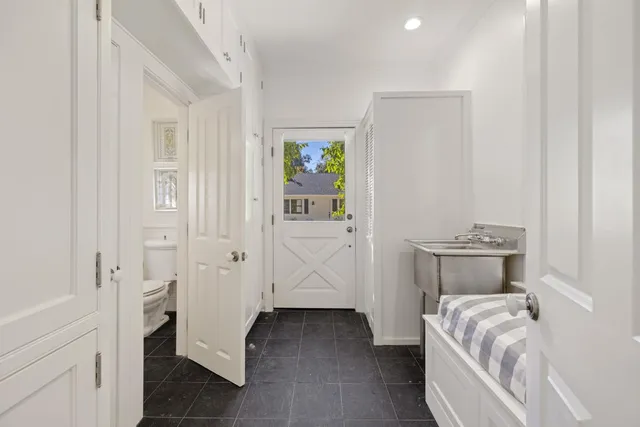 a bedroom with a large bed and a large window