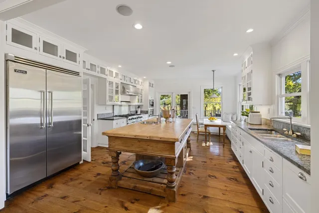 a view of swimming pool with outdoor seating and plants