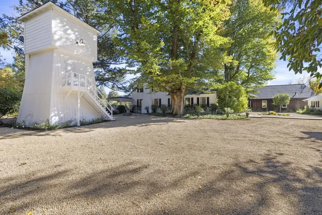 a utility room with a floor to ceiling window and trees