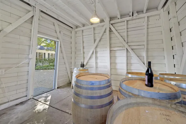 a kitchen with stainless steel appliances granite countertop a stove and a white cabinets