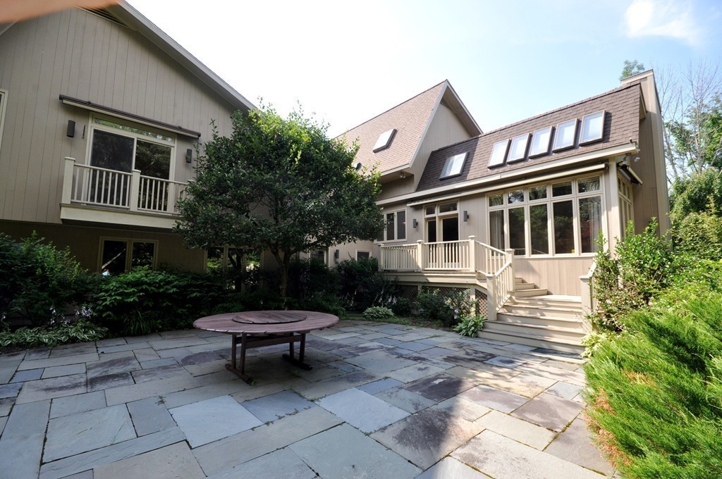 10 Rice Road Sudbury, MA 01776 - Photo 6 of 29 a front view of a house with a yard