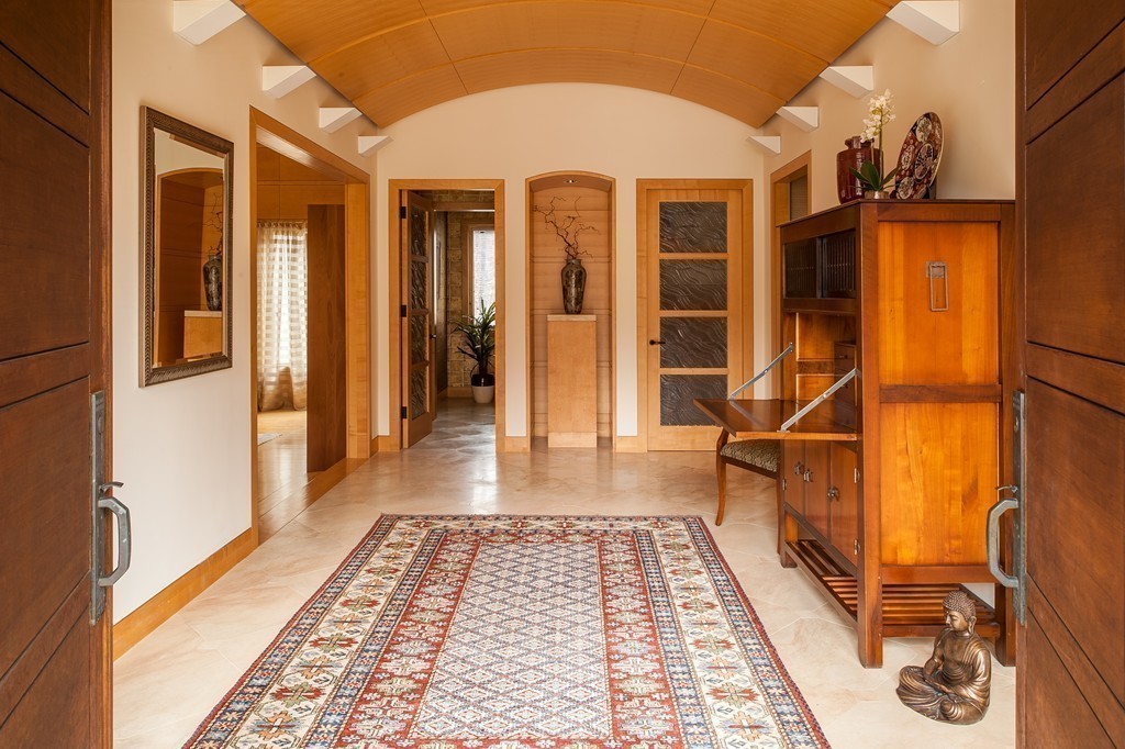 10 Rice Road Sudbury, MA 01776 - Photo 7 of 29 a view of a hallway with wooden floor and a rug