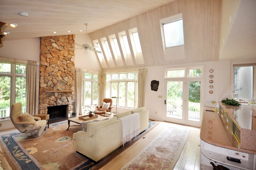 10 Rice Road Sudbury, MA 01776 - Photo 9 of 29 a living room with fireplace furniture and a large window