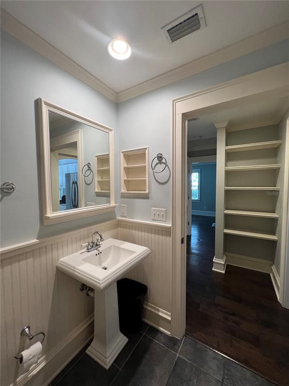 433 Southeast 7th Street Gainesville, FL 32601 - Photo 14 of 28 a bathroom with a sink and a mirror