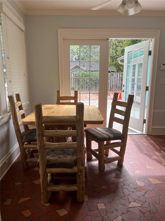 433 Southeast 7th Street Gainesville, FL 32601 - Photo 15 of 28 a view of a dining room with furniture window and outside view