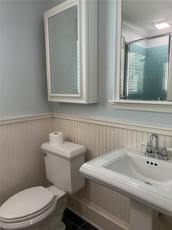433 Southeast 7th Street Gainesville, FL 32601 - Photo 18 of 28 a bathroom with a sink a toilet and mirror