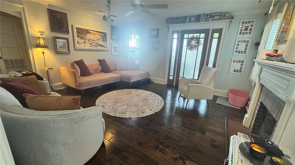 433 Southeast 7th Street Gainesville, FL 32601 - Photo 5 of 28 a living room with furniture and wooden floor