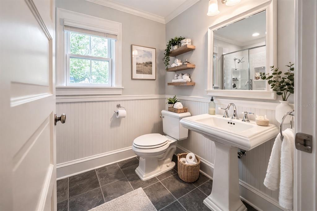 433 Southeast 7th Street Gainesville, FL 32601 - Photo 6 of 28 a bathroom with a sink toilet and a mirror