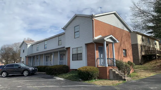 a view of a car park in front of house